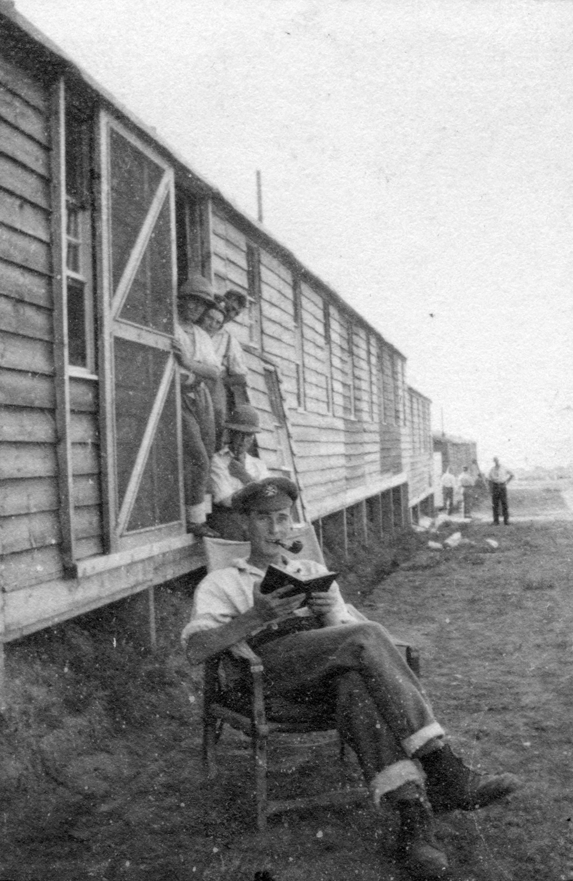 A man reading outside No. 5 Canadian General Hospital.jpg