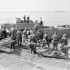 Personnel of the Royal Canadian Army Medical Corps treating "casualties" during the final rehearsal for Operation JUBILEE, the raid on Dieppe. England, August 1942.