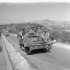 Infantrymen of The Hastings and Prince Edward Regiment  in a Universal Carrier advancing on Nissoria, Italy, July 1943.