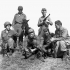 Forcemen of The First Special Service Force, who carry automatic weapons, posing with an Italian colt in the Anzio beachhead, Italy, 20 April 1944.
