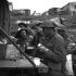 Personnel of the Loyal Edmonton Regiment having tea and sandwiches outside Battalion Headquarters, Ortona, Italy, 21 December 1943.