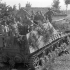 Personnel of the Westminster Regiment, 5th Canadian Armoured Brigade, examining a self-propelled field Howitzer "Hummel" knocked out by PIAT gun, near Pontecorvo, Italy, 26 May 1944.