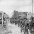 Infantrymen of Le Régiment de la Chaudière moving through Bernières-sur-Mer, France, 6 June 1944.