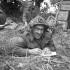 An unidentified infantryman of the 9th Canadian Infantry Brigade writing a letter home from the Normandy beachhead, France, ca. 8-9 June 1944.