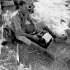 War correspondent Ross Munro of the Canadian Press typing a story in the battle area between Valguarnera and Leonforte, Italy, August 1943.
