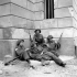 Infantrymen of The Highland Light Infantry of Canada having a rest, Caen, France, 10 July 1944.
