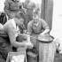 Infantrymen of The Highland Light Infantry of Canada cooking a meal aboard LCI(L) 306 of the 2nd Canadian (262nd RN) Flotilla en route to France on D-Day, 6 June 1944.