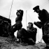 Personnel of the 17th Field Regiment, Royal Canadian Artillery (R.C.A.), receiving signals from a Taylorcraft Auster A.O.P. III aircraft of the Royal Air Force, Castel Frentano, Italy, 10 February 1944.