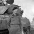 Captain W.H. Ellis of The Ontario Regiment hearing the news that he will attend staff college in Canada. Lanciano, Italy, 8 February 1944.