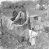 Private James Sproul of the 10th Field Regiment, Royal Canadian Engineers (R.C.E.), hanging washing on the line, Castel Frentano, Italy, 20 December 1943.