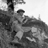 Private J.E. McPhee of The Seaforth Highlanders of Canada, who is armed with a sniper rifle, under German mortar fire, Foiano, Italy, 6 October 1943.