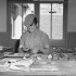 Private Ed Pauzé setting type to print the first issue of the Maple Leaf newspaper, Caen, France, 28 July 1944.