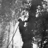 Signalman F. Roy of the Royal Canadian Corps of Signals (R.C.C.S.), 9th Canadian Infantry Brigade,  stringing wires for a signals exchange, Normandy, France, 24 June 1944.