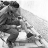 Sapper L.C. St. Denis of the 2nd Field Park Company, Royal Canadian Engineers (R.C.E.), exercising his wounded legs at No.1 Convalescent Depot, Royal Canadian Army Medical Corps (R.C.A.M.C.), Salerno, Italy, ca.1-2 May 1944.