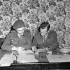 Captains Alan Duckett and Seth Halton censoring copy to be printed in the first issue of the Maple Leaf newspaper, Caen, France, 28 July 1944.