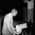 Lance-Corporal Frank Dubois casting a printing plate of the first issue of the Maple Leaf newspaper to be printed in Caen, France, 28 July 1944.
