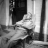 Photographer Eddie Worth of the Associated Press taking a rest in Caen, France, 28 July 1944.