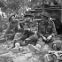 Canadian soldiers relaxing outside their dugout, Caen, France, 10 July 1944.