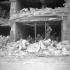 Infantrymen of The Regina Rifle Regiment inside a damaged building, Caen, France, 10 July 1944.