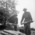 Gunners J.R. Robinson and L.T. Groves, both of 34 Battery, 14th Field Regiment, Royal Canadian Artillery (R.C.A.), stacking 105mm. shells in Normandy, France, 20 June 1944.