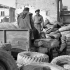 Loading used rubber tires being returned to England for recycling, 5th Canadian Armoured Division Ordnance Field Park, Royal Canadian Ordnance Corps, Rimini, Italy, 22 January 1945.