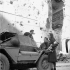 Troopers W. Balinnan and A. Gallant of a Canadian reconnaissance regiment speaking to partisans Louisa and Italo Cristofori after the capture of Bagnacavallo, Italy, 3 January 1945.