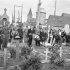 Brigadier W. Basil Wedd of Headquarters, 1st Canadian Army, placing a wreath on the graves of Canadian soldiers killed at Dieppe on 19 August 1942. Ambleteuse, France, 23 September 1944.