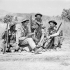 H/Captain S.B. East, a chaplain, talking with soldiers of the 48th Highlanders of Canada near Regalbuto, Italy, July-August 1943.
