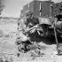 Private R.E. Hill repairing his Universal Carrier, Catania, Italy, 22 August 1943.
