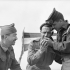 l Canadian Navy Beach Commando “W”, talking with Private M. Belanger ((left) and Corporal P. Jenkins of Le Régiment de la Chaudière in the Juno sector of the Normandy beachhead, France, 20 July 1944.