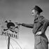 Able Seaman Douglas F. Trewin, W-2 Party, Royal Canadian Navy Beach Commando "W", points out a Able Seaman Douglas F. Trewin, W-2 Party, Royal Canadian Navy Beach Commando “W”, points out a German sign warning of mines in the Juno sector of the Normandy beachhead, France, 20 July 1944.