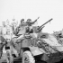 Personnel of the 17th Duke of York's Royal Canadian Hussars in their Humber Mk. IV armoured car in Normandy, France, 18-20 July 1944.