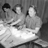 Nursing sisters of the Royal Canadian Army Medical Corps (R.C.A.M.C.) making bandages at a British hospital in the Normandy bridgehead, France, 17 July 1944.