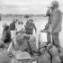 Reinforcements going ashore from a Landing Craft Assault (LCA) from H.M.C.S. PRINCE HENRY off the Normandy bridgehead, June 1944.