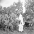 Infantrymen of the Royal 22e Régiment receiving Holy Communion from the unit's chaplain, H/Major Leo Grattan, before going on a reconnaissance patrol, Italy, October 1943.