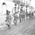 Infantrymen of the Hastings and Prince Edward Regiment advancing through Motta, Italy, 2 October 1943.