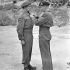 General Sir Bernard L. Montgomery decorating Lance-Corporal Russell A. Geddes, 6 Platoon, “B” Company, 1st Canadian Parachute Battalion, with the Military Medal in the Normandy beachhead, France, 16 July 1944.