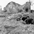 Sergeant F.V. MacDougal and Sergeant-Major J.H. Ferguson, 2nd Field Regiment, Royal Canadian Artillery (R.C.A.), emerging from their dugout north of Ortona, Italy, 15 February 1944.