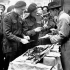 Troopers of the Governor General's Horse Guards at an outdoor shop on the Via Roma, Naples, Italy, 27 November 1943.