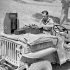 Engineer Paul Johnston  of the Canadian Broadcasting Corporation setting up equipment to record a broadcast by CBC correspondent Matthew Halton, Catangora, Italy, 14 September 1943.