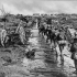 Infantry marching ahead in single file to the front line. Photographer Captain James Francis "Frank" Hurley.